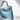 Tailored Styling Hermès Mini Kelly 20 bag in Blue Celeste Epsom leather with palladium hardware, side profile view.